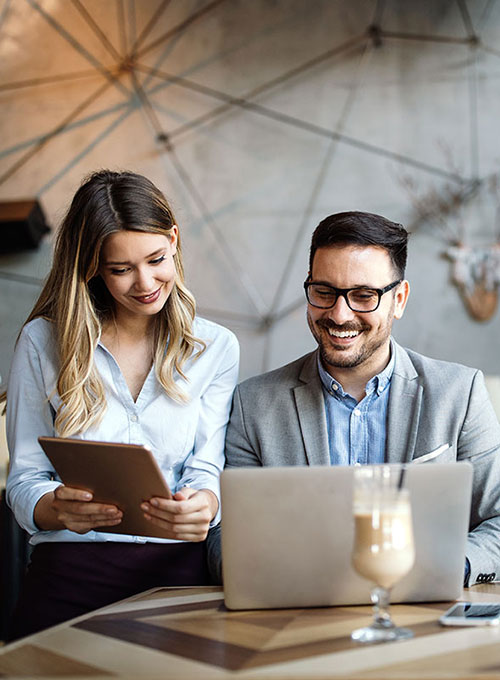 Two people working in a cafe.